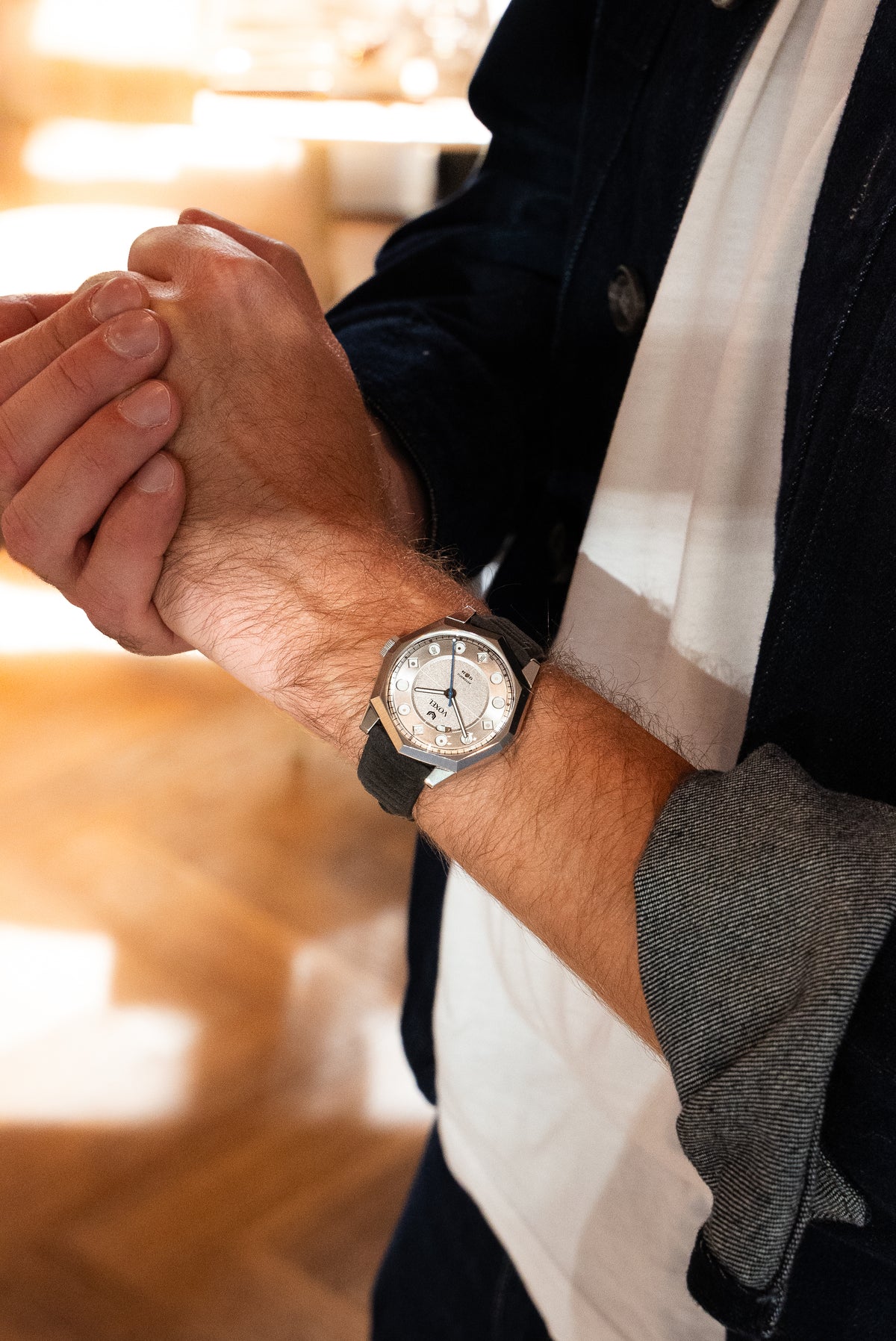 Man wearing the VOXEL Meridion silver star dial watch on his wrist