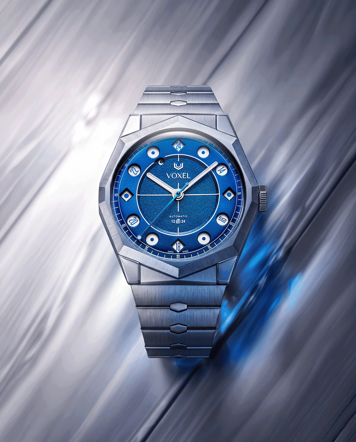 VOXEL Meridion Electric Blue Dial on integrated 904L steel bracelet, angled view on a brushed metal background