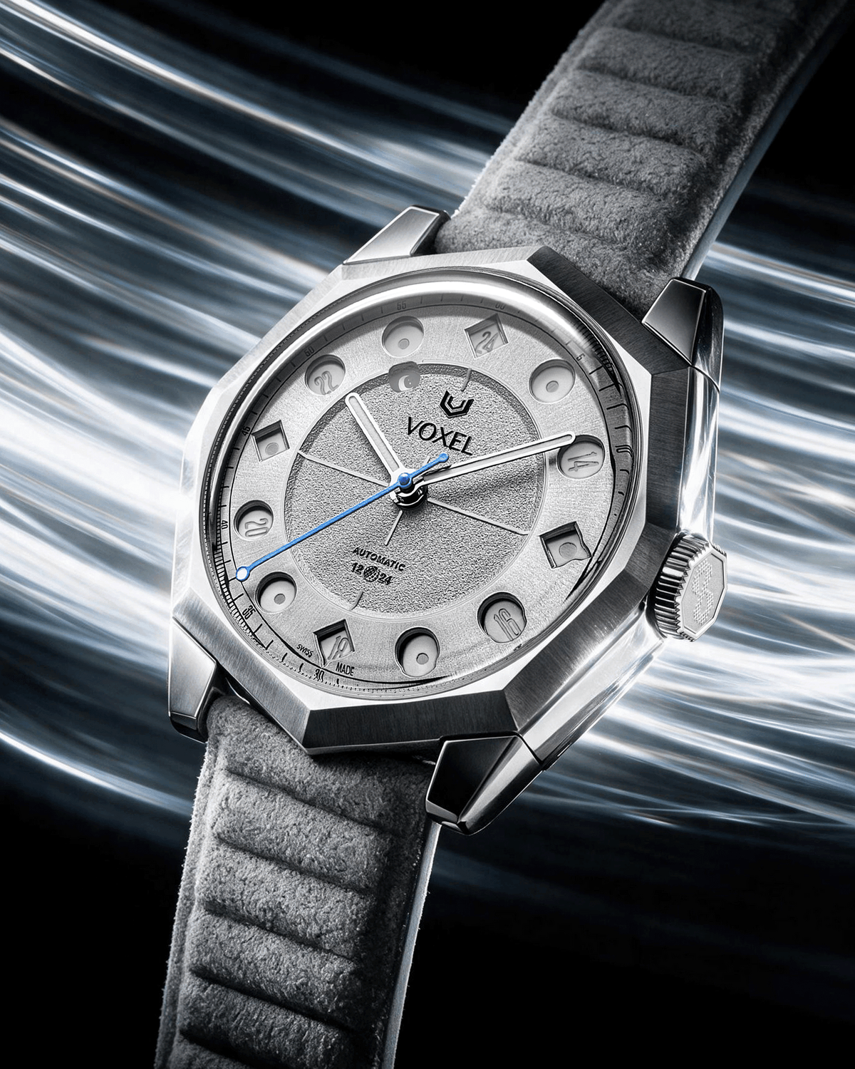 VOXEL Meridion silver star dial watch with decagonal steel case and grey Alcantara strap, shown in 24-hour mode