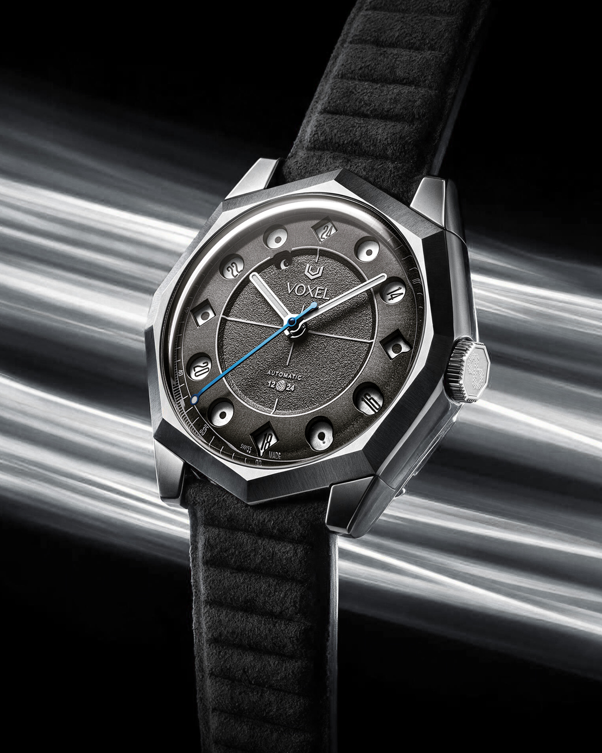 VOXEL Meridion Charcoal Black Dial with black Alcantara strap, three-quarter view in 24-hour mode with light trails